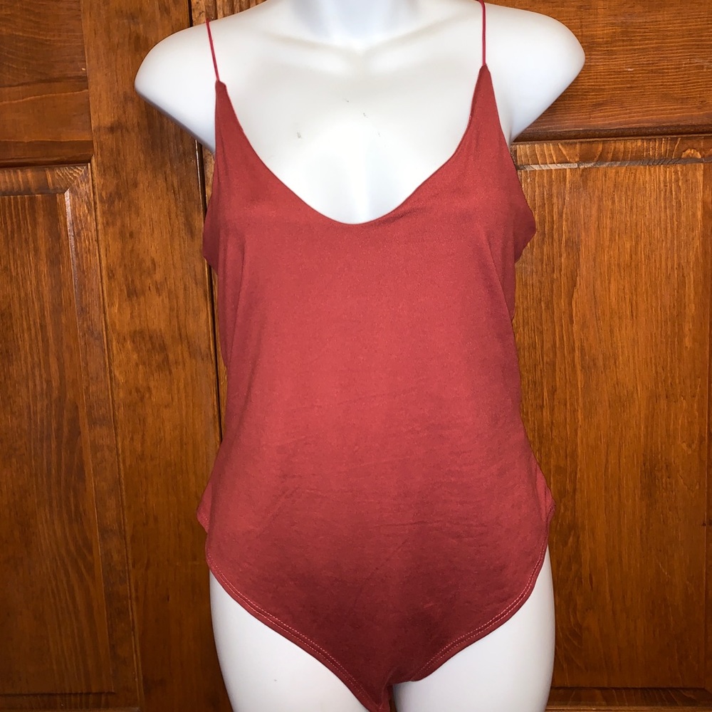 Soft and sexy, low cut, burgundy bodysuit